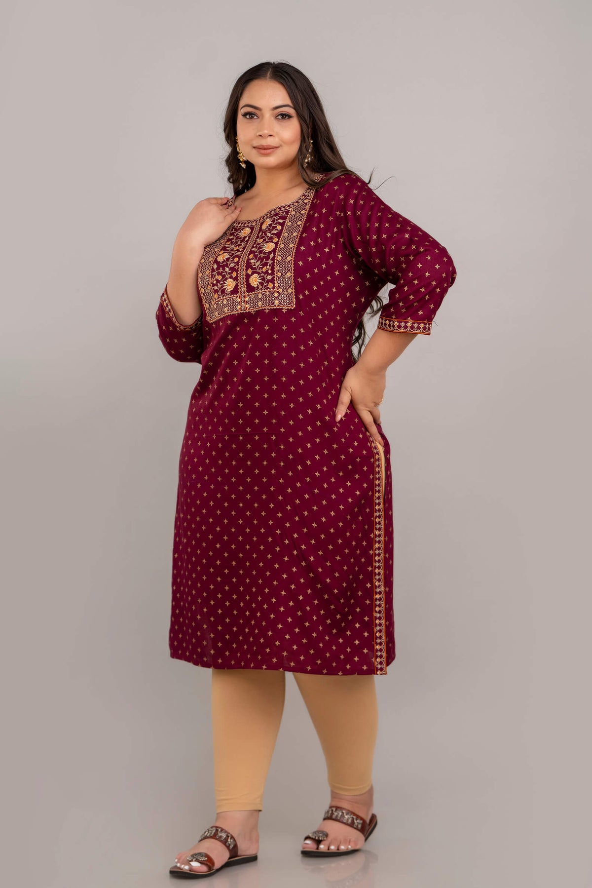 Angled full-length view of maroon rayon embroidered kurti with side slits, curvy women clothing