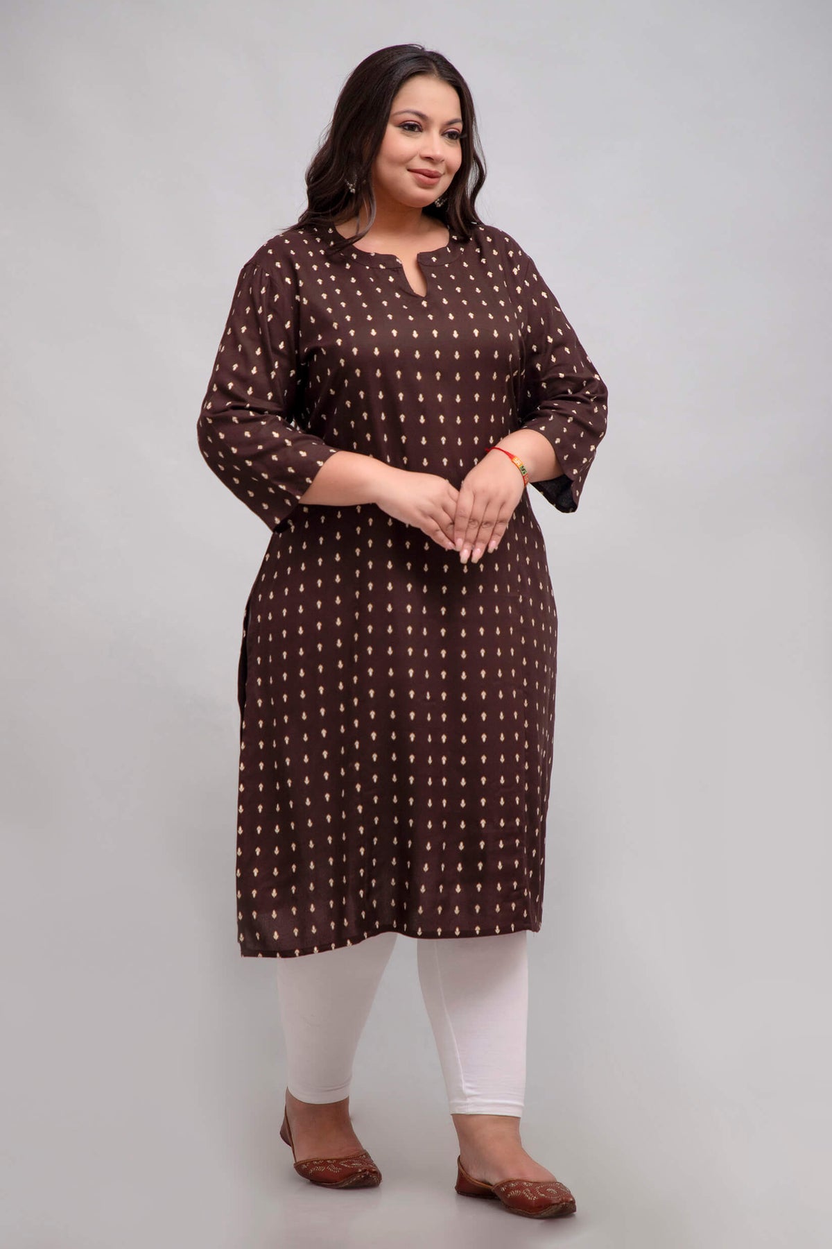 Close portrait of model wearing brown rayon kurti; elegant big size fit for curvy women