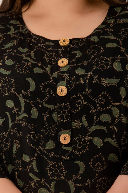 Close-up of round neckline and wooden buttons on black rayon discharge-print kurti for curvy women