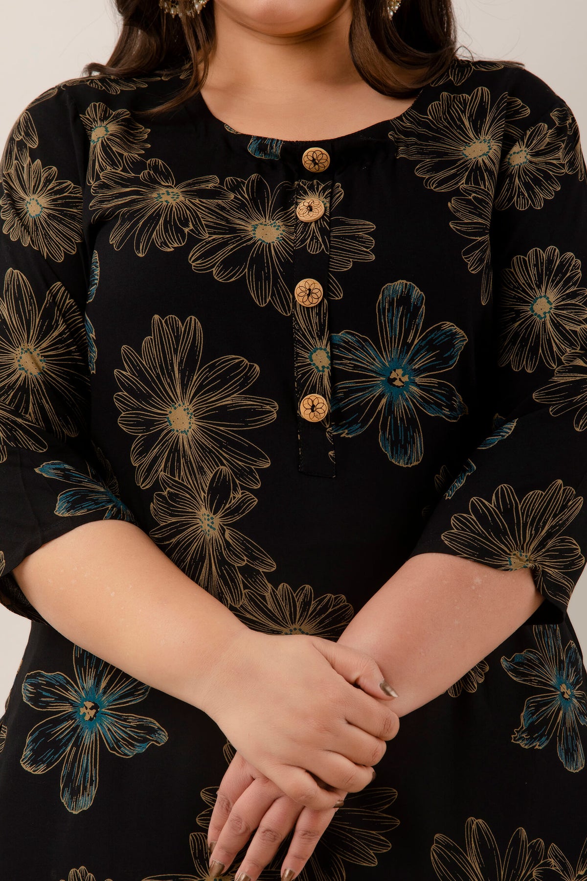 Close-up of round neckline and wooden buttons on black rayon discharge-print kurti for curvy women