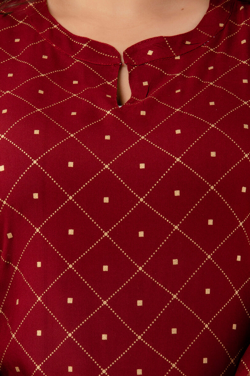 Notch-neck detail of maroon diamond print kurti; neat finishing and soft hand-feel; chic festive-casual piece.