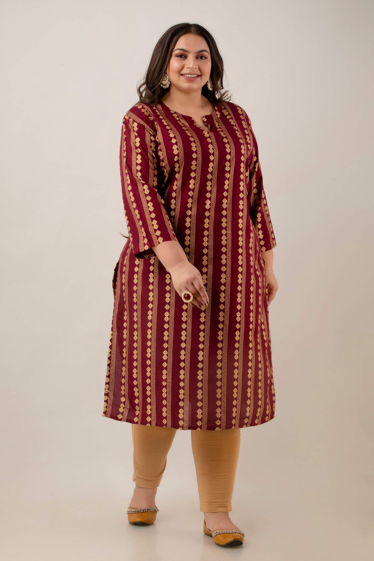 Angled full-length view of maroon rayon kurti, elongating vertical pattern for curvy women