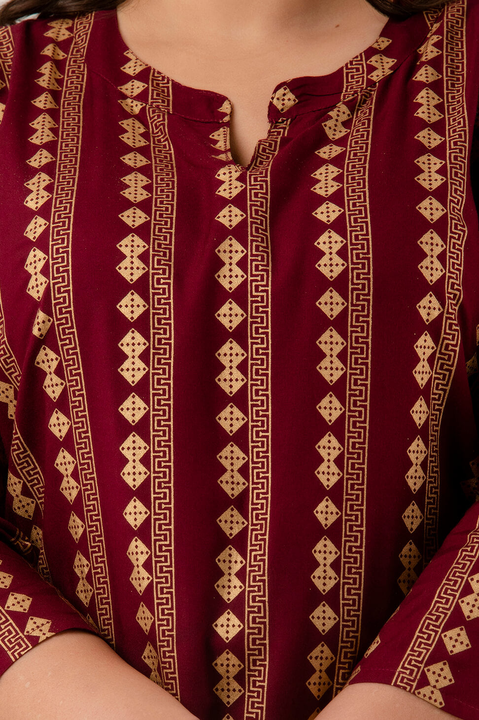 Close-up of round notch neckline on maroon rayon kurti, comfortable everyday workwear