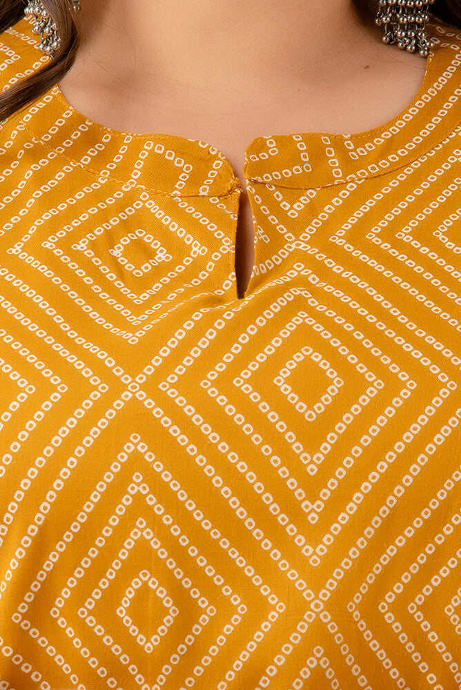 Notch-neck detail of mustard geometric print kurti; tidy finishing, soft hand-feel; versatile ethnic essential.