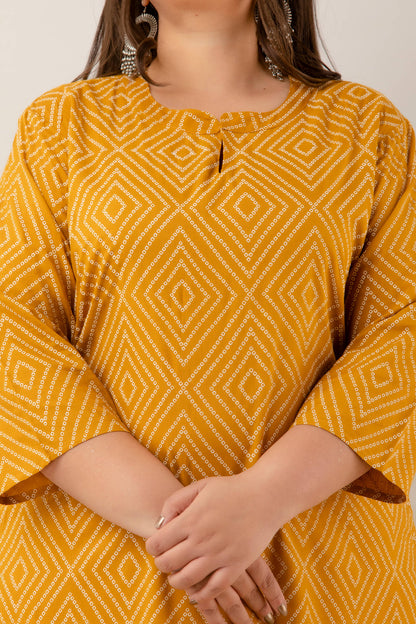 Closeup of diamond-dot geometric print on mustard rayon; lightweight, breathable fabric; chic pattern for big-size wardrobes.