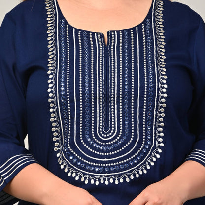 Close up of mirror work concentric yoke and notch neckline on navy rayon kurti for curvy women
