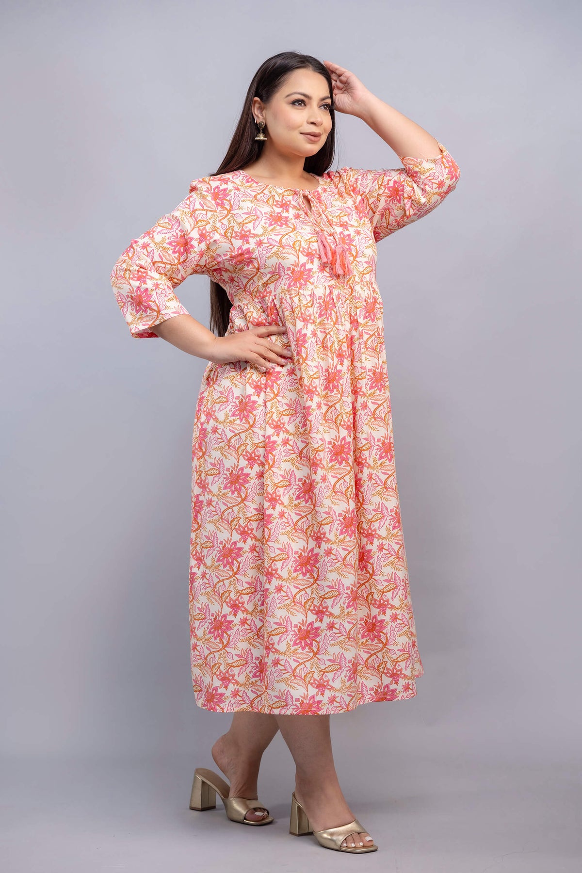 Side angle of peach pink floral rayon gathered gown for big size women