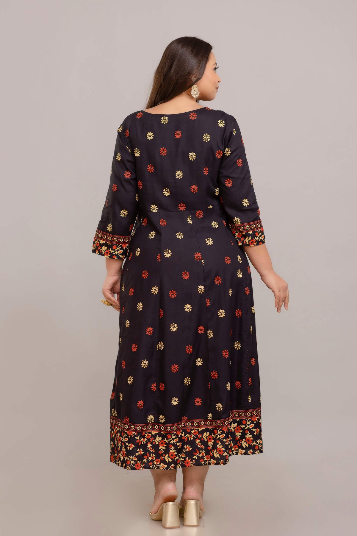 Back view of plus size black printed rayon gown for curvy fat women, comfortable flared dress