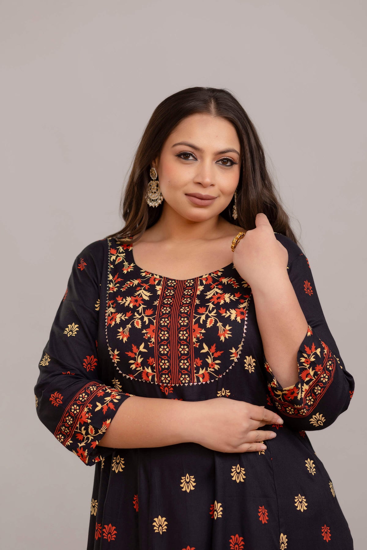 Closeup of ethnic neckline print on plus size black rayon gown for fat women, festive wear