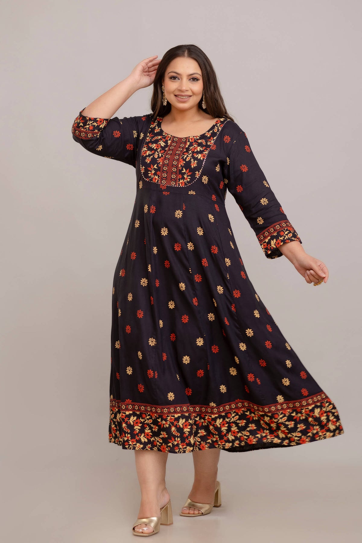 Curvy fat woman twirling in black rayon printed gown, flowy plus size ethnic outfit 3XL–10XL