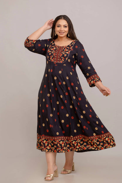 Curvy fat woman twirling in black rayon printed gown, flowy plus size ethnic outfit 3XL–10XL