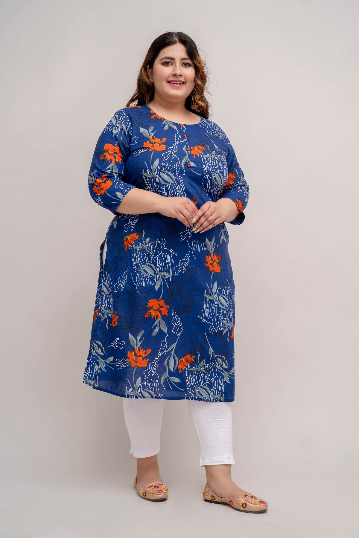 Walking shot of Plus Size floral cotton kurti on blue base, office to casual look, fat-friendly drape, sizes 3XL–9XL