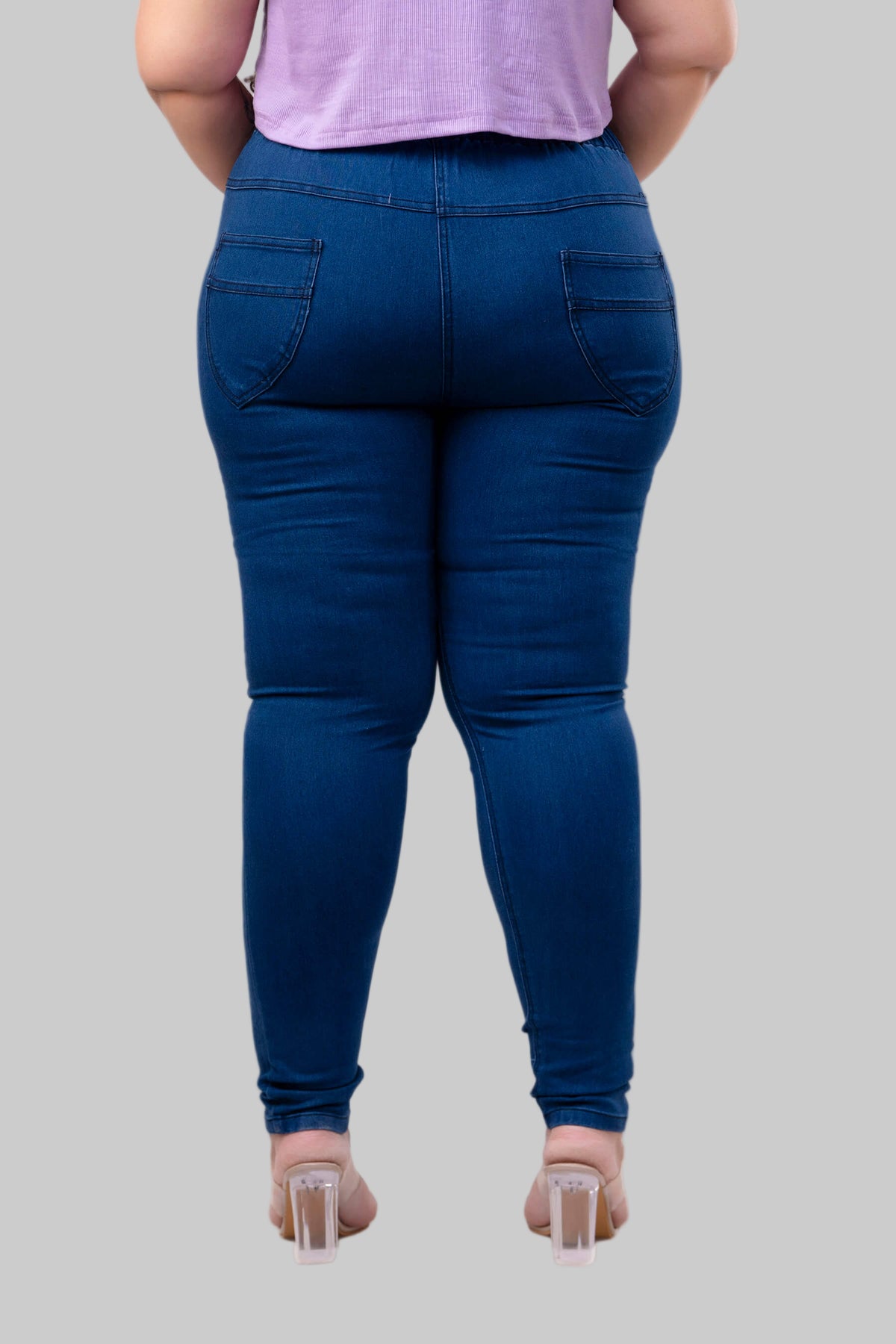 Back view of plus size blue jeggings with curved patch pockets for big size women – Curvisha