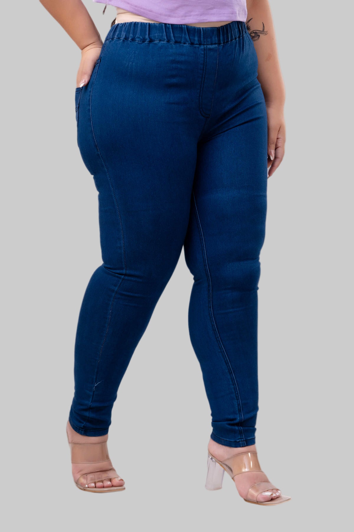 Side view of blue denim jeggings for curvy and fat women showing sleek tapered fit – Curvisha