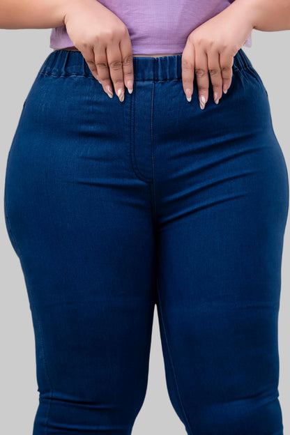 Close-up of waistband stretch detail on blue jeggings for curvy women – Curvisha
