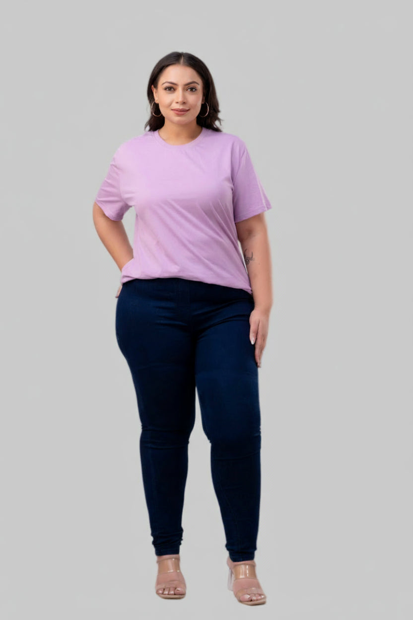 Full front view of plus size dark blue denim jeggings for curvy women styled with lilac top – Curvisha