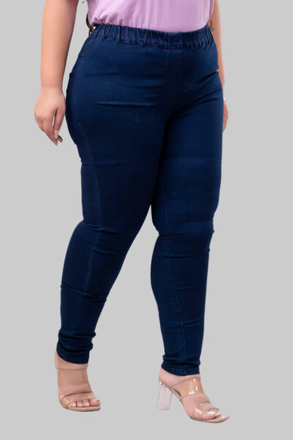 Three-quarter look of dark blue denim jeggings for big size women styled with nude heels – Curvisha