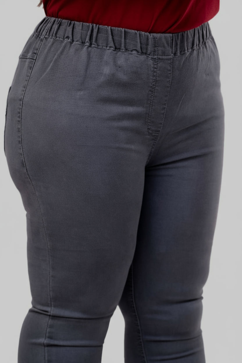 Close-up of elastic waistband and fine stitching on plus size grey denim jeggings – Curvisha