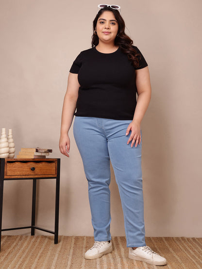 Angle view of light blue stretch denim jeggings showing comfortable fit and smooth silhouette – Curvisha