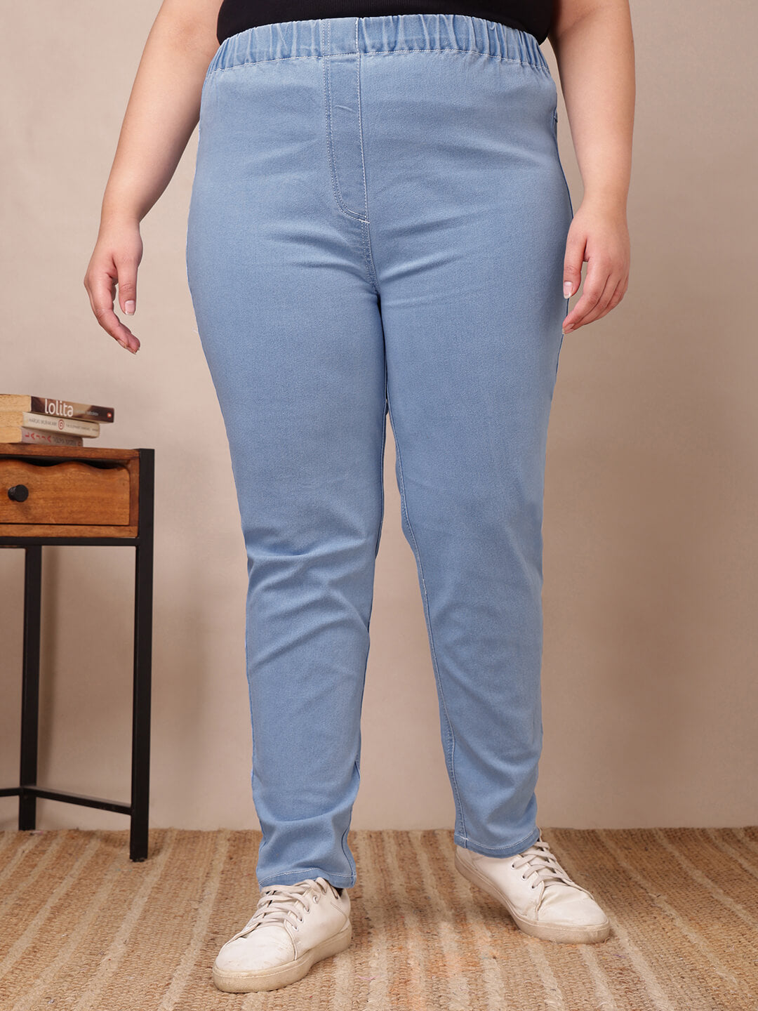 Front view of plus size light blue denim jeggings with slim fit and high waist for curvy women – Curvisha