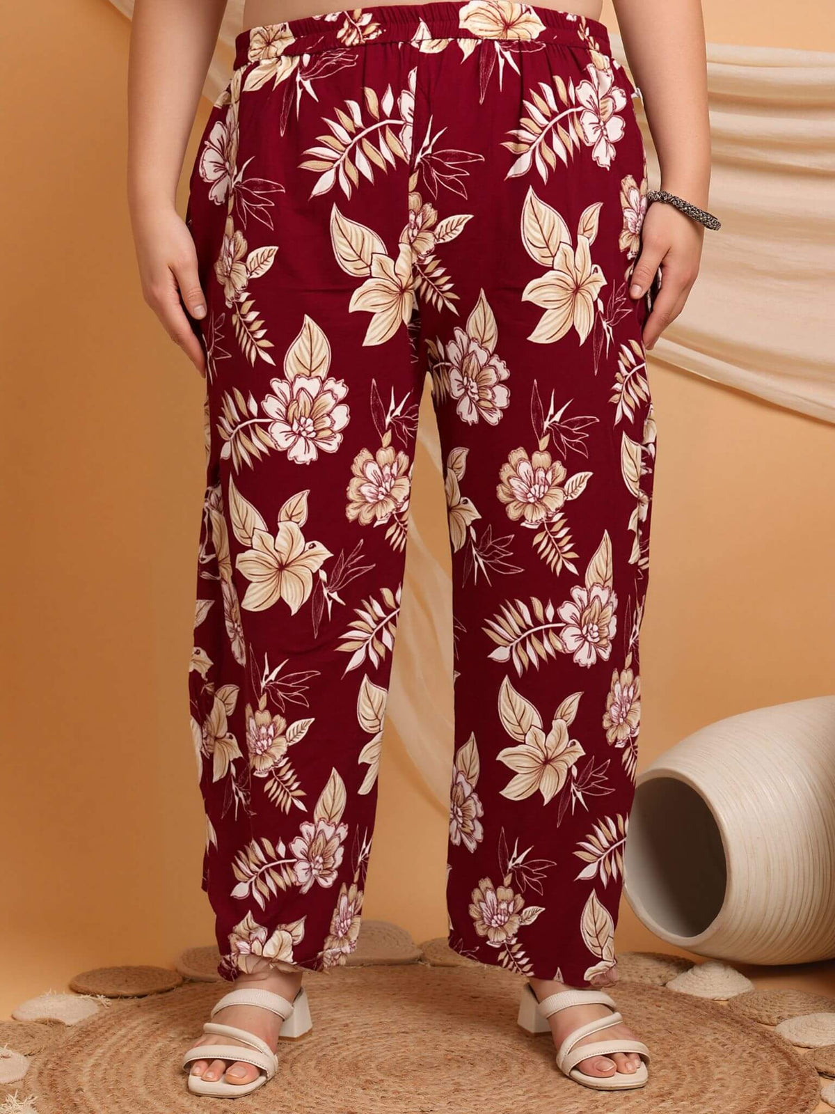 Close-up of maroon cotton floral printed pants with elastic waistband, breathable cotton comfort for curvy women – Curvisha