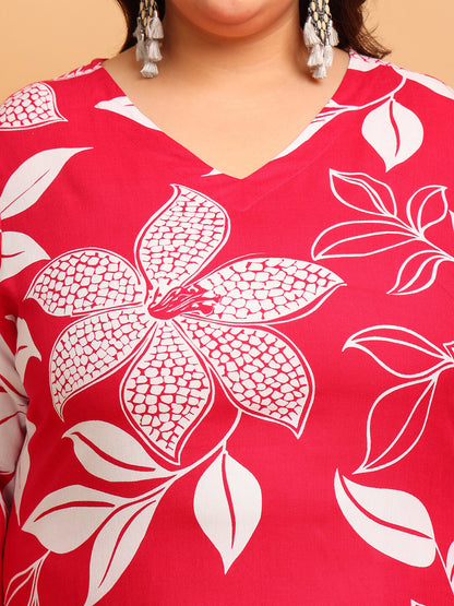 Close-up of V-neck red rayon kurti with bold white floral design and smooth drape for curvy women – Curvisha