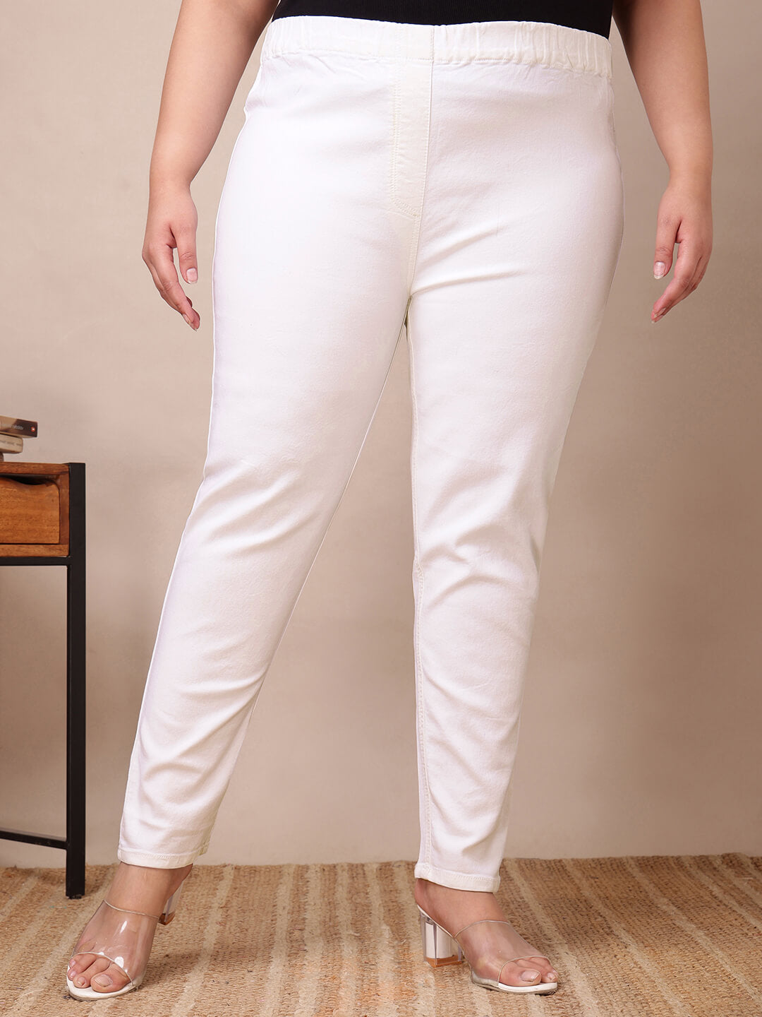 Front close-up of white stretch jeggings showing elastic waist and smooth fit for curvy women – Curvisha