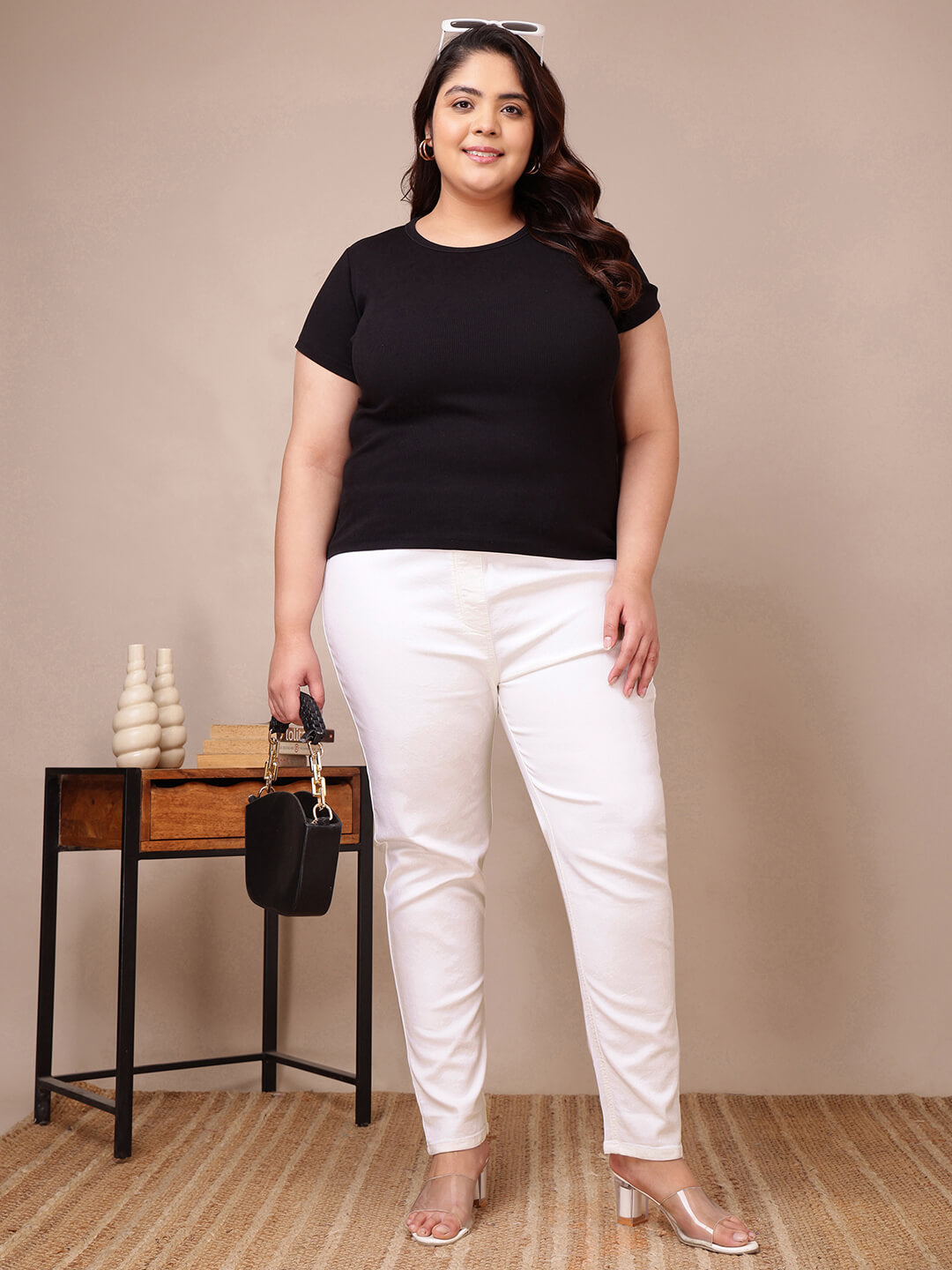 Full front view of plus size white denim jeggings styled with black top and heels for curvy women – Curvisha