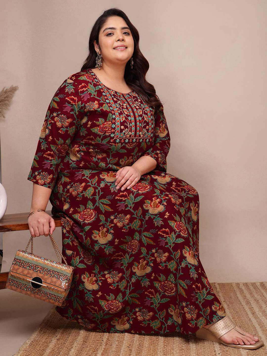 Maroon embroidered rayon gown dress seated view for fat plus size women