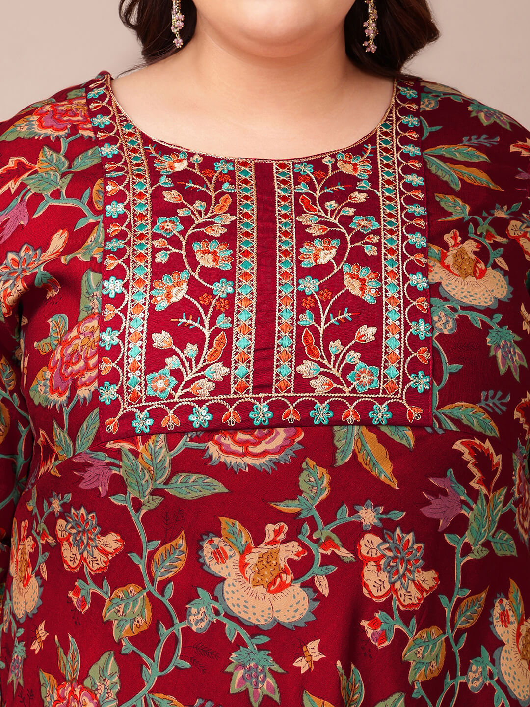Close up detailed embroidered yoke on maroon gown dress for fat women