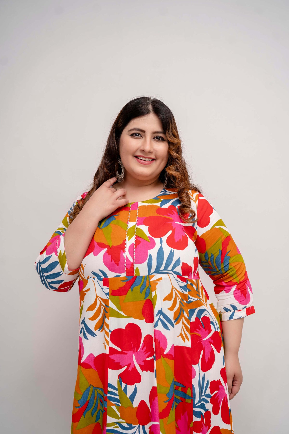 Close up of neckline and vibrant floral print rayon gown for curvy women, soft breathable rayon in bright colors