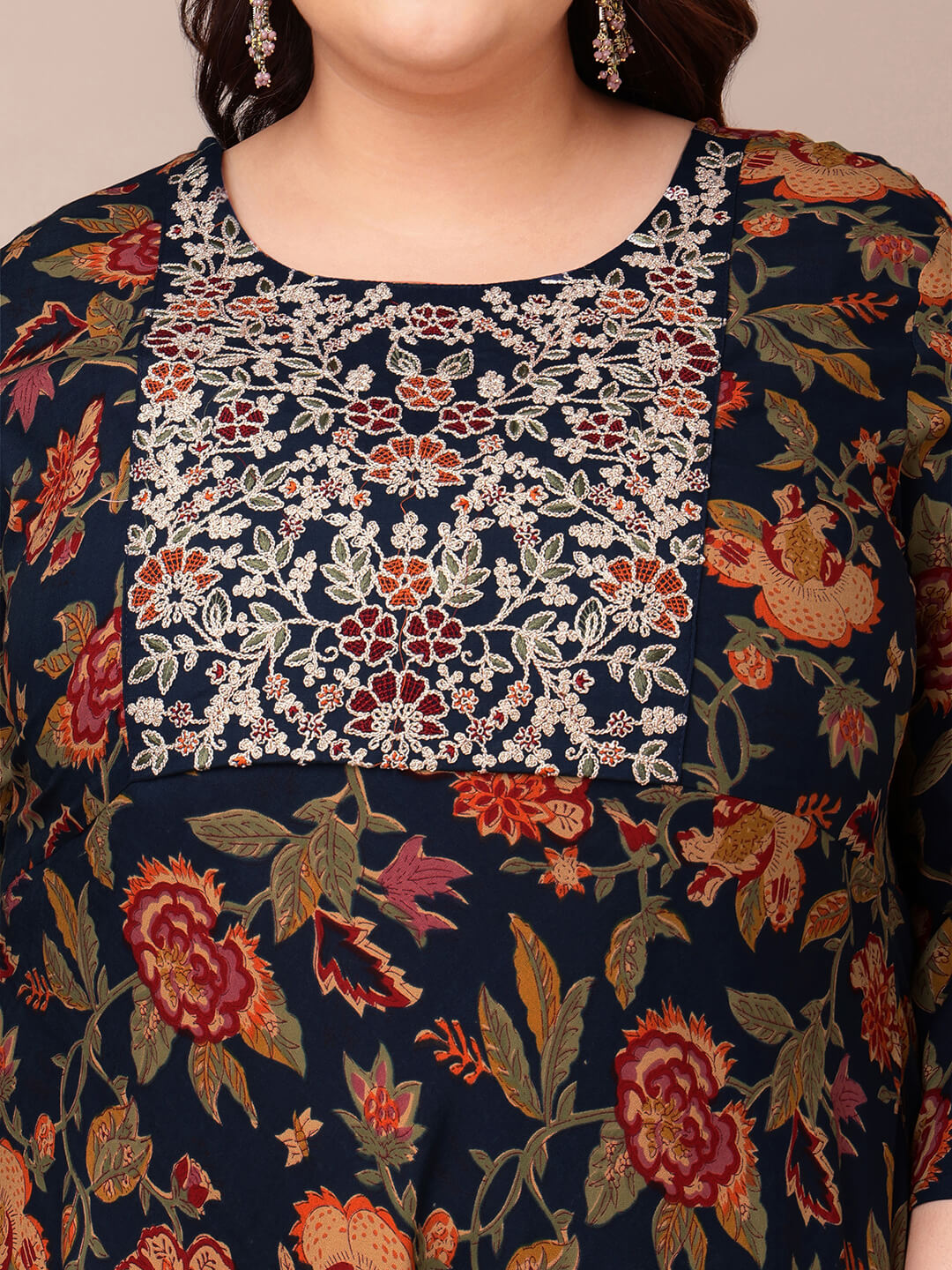 Close up embroidered yoke of navy gown for plus size fat women