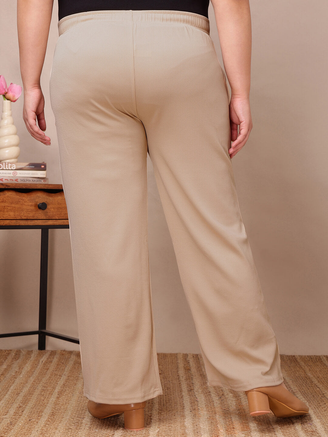 Back view of beige ribbed wide-leg lounge pants for plus size women, relaxed silhouette – Curvisha