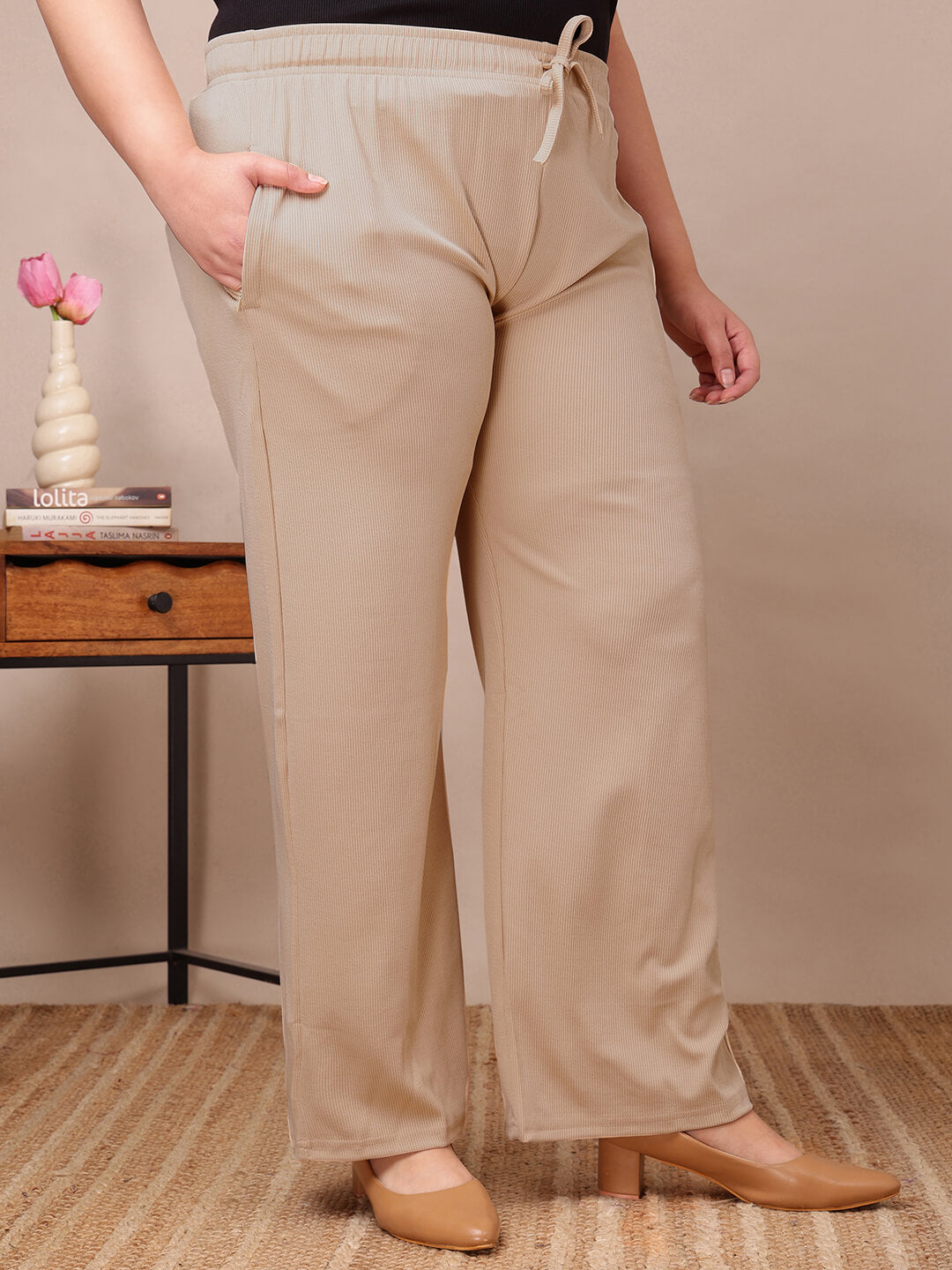Front view of plus size beige ribbed lounge pants with drawstring waist and stretch comfort – Curvisha big size