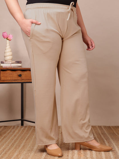 Front view of plus size beige ribbed lounge pants with drawstring waist and stretch comfort – Curvisha big size