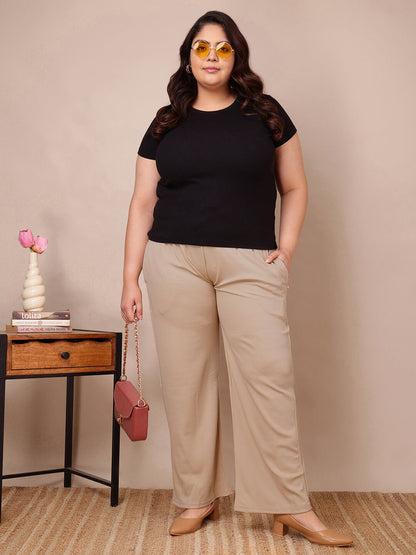 Beige ribbed wide-leg trousers for curvy full-figure women, relaxed drape and stretch fit