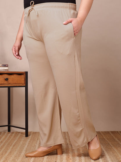 Side view of beige ribbed wide-leg pants for fat women clothing, soft ribbed fabric and zip pockets – Curvisha