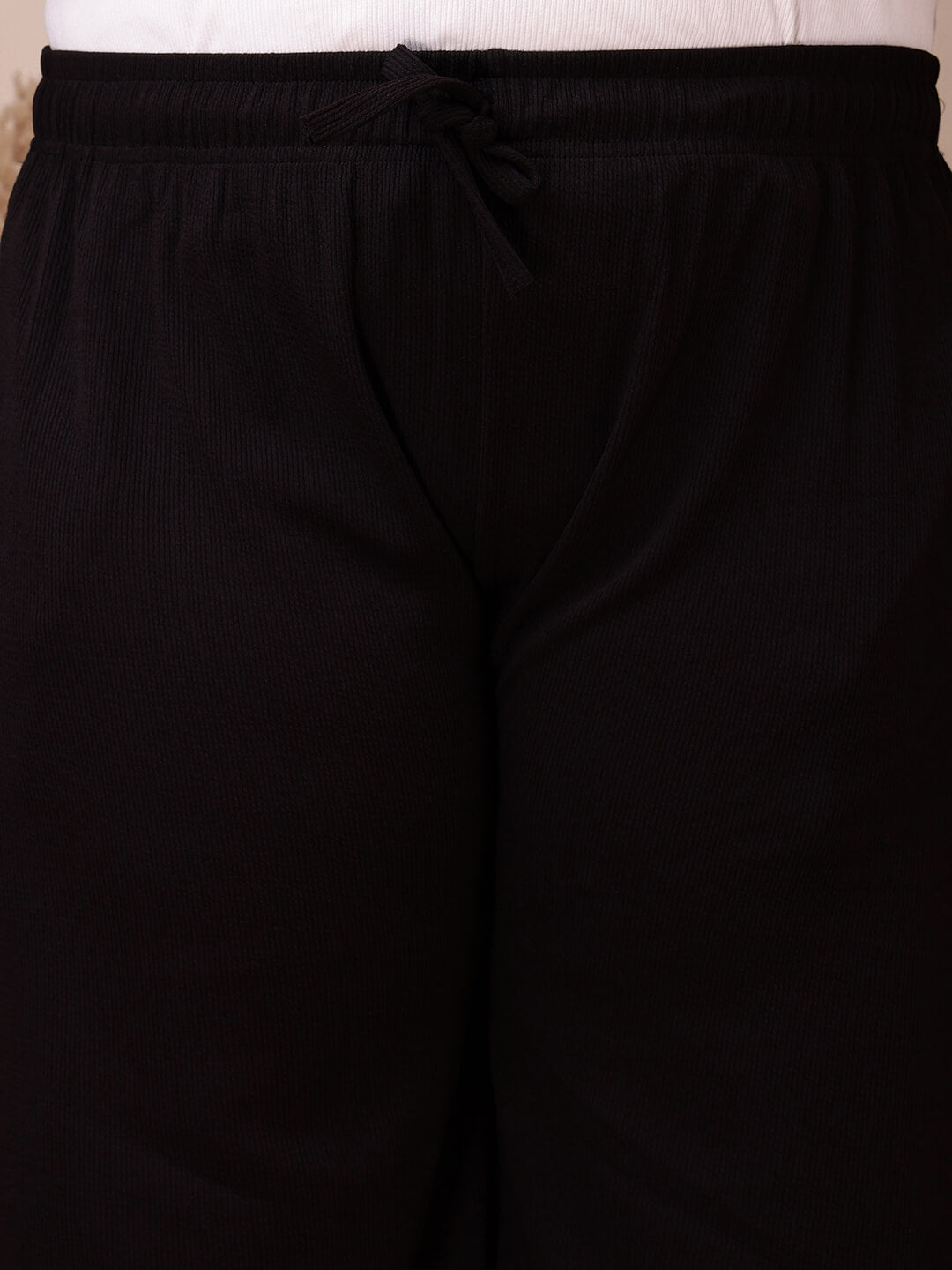 Close-up of drawstring waistband on black ribbed pants for big size comfort and stretch – Curvisha