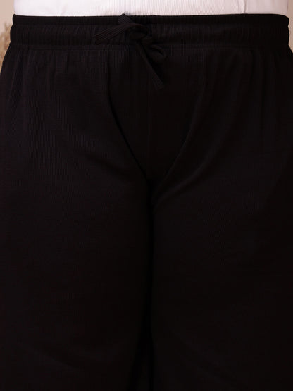 Close-up of drawstring waistband on black ribbed pants for big size comfort and stretch – Curvisha