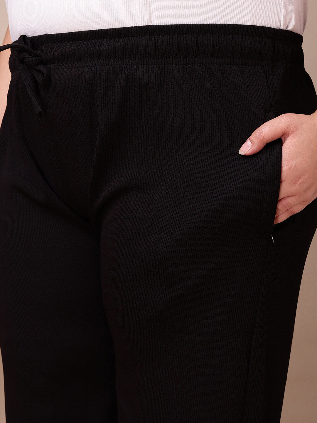 Pocket detail on black ribbed wide-leg pants for plus size women, breathable soft knit fabric – Curvisha