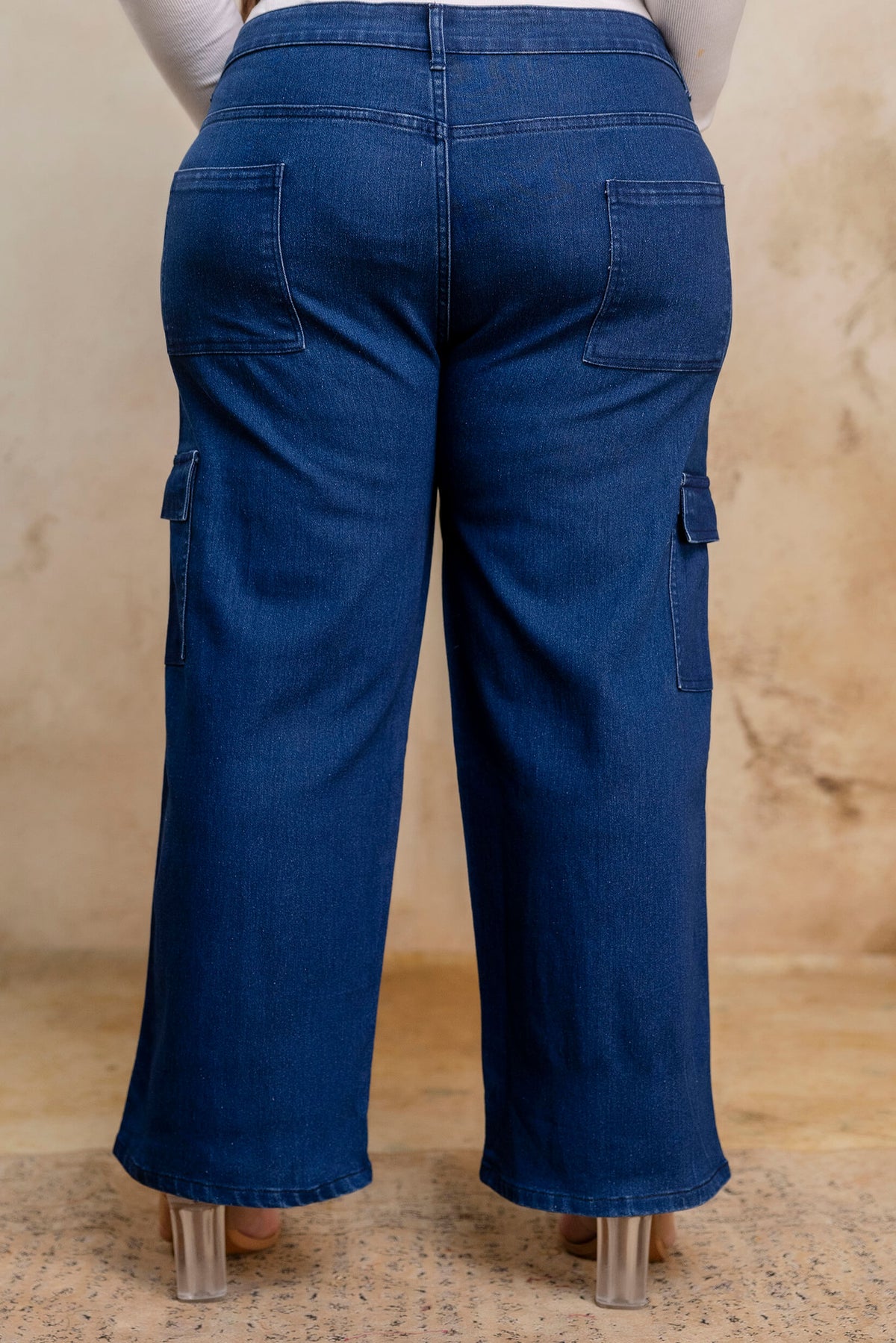 Plus size buttoned dark blue denim pants back view for fat women, wide leg big size clothing