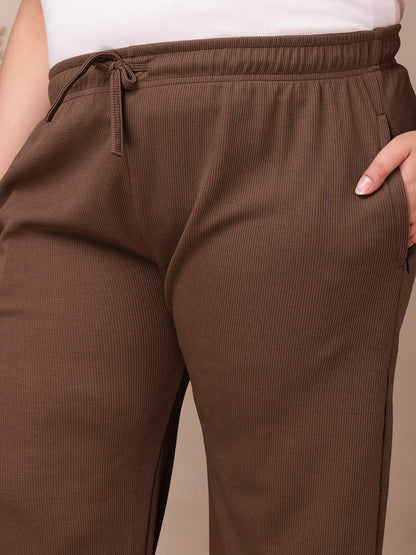 Pocket detail on coffee brown ribbed wide-leg pants for plus size women, breathable ribbed fabric – Curvisha