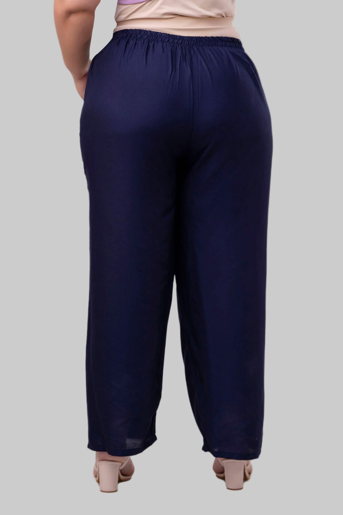 Back view of plus size navy blue rayon palazzo pants for curvy women, elegant wide-leg – Curvisha