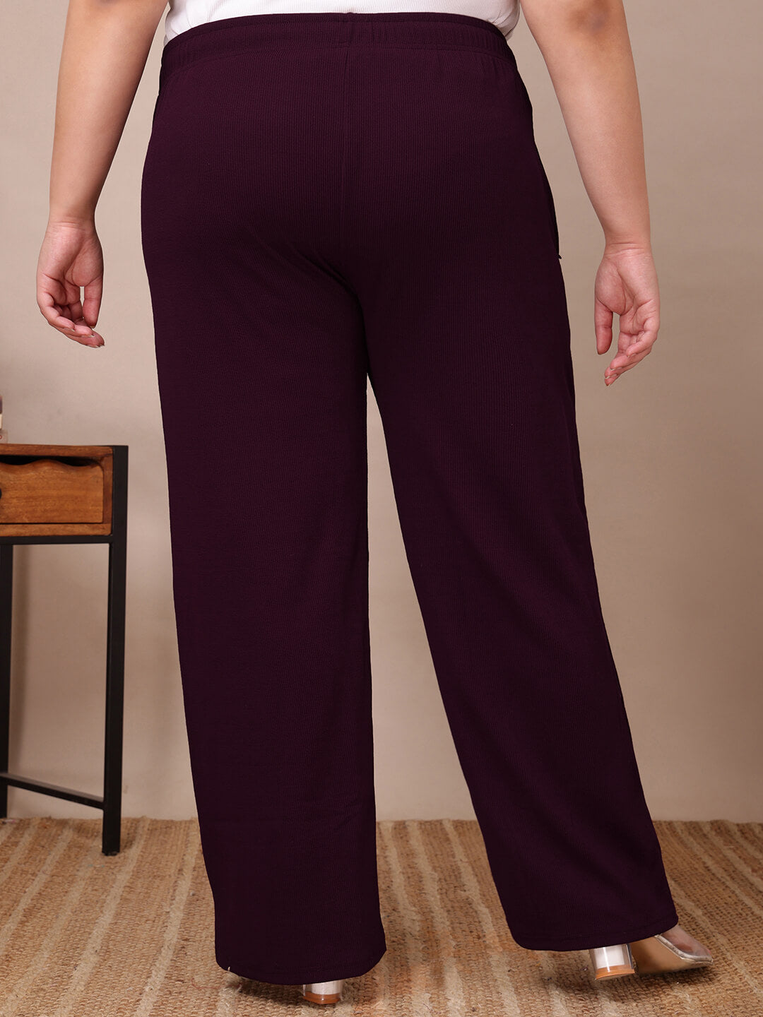 Back view of plum ribbed wide-leg pants for curvy women, relaxed fit and elegant drape – Curvisha