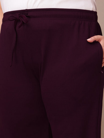 Pocket detail on plum ribbed wide-leg pants for plus size women, soft stretch fabric – Curvisha