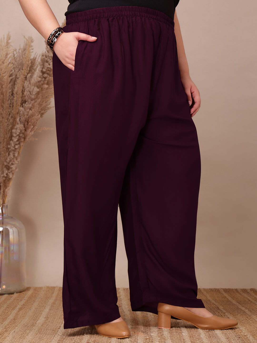 Front view of plus size purple rayon palazzo pants with elastic waistband and side pockets – Curvisha big size