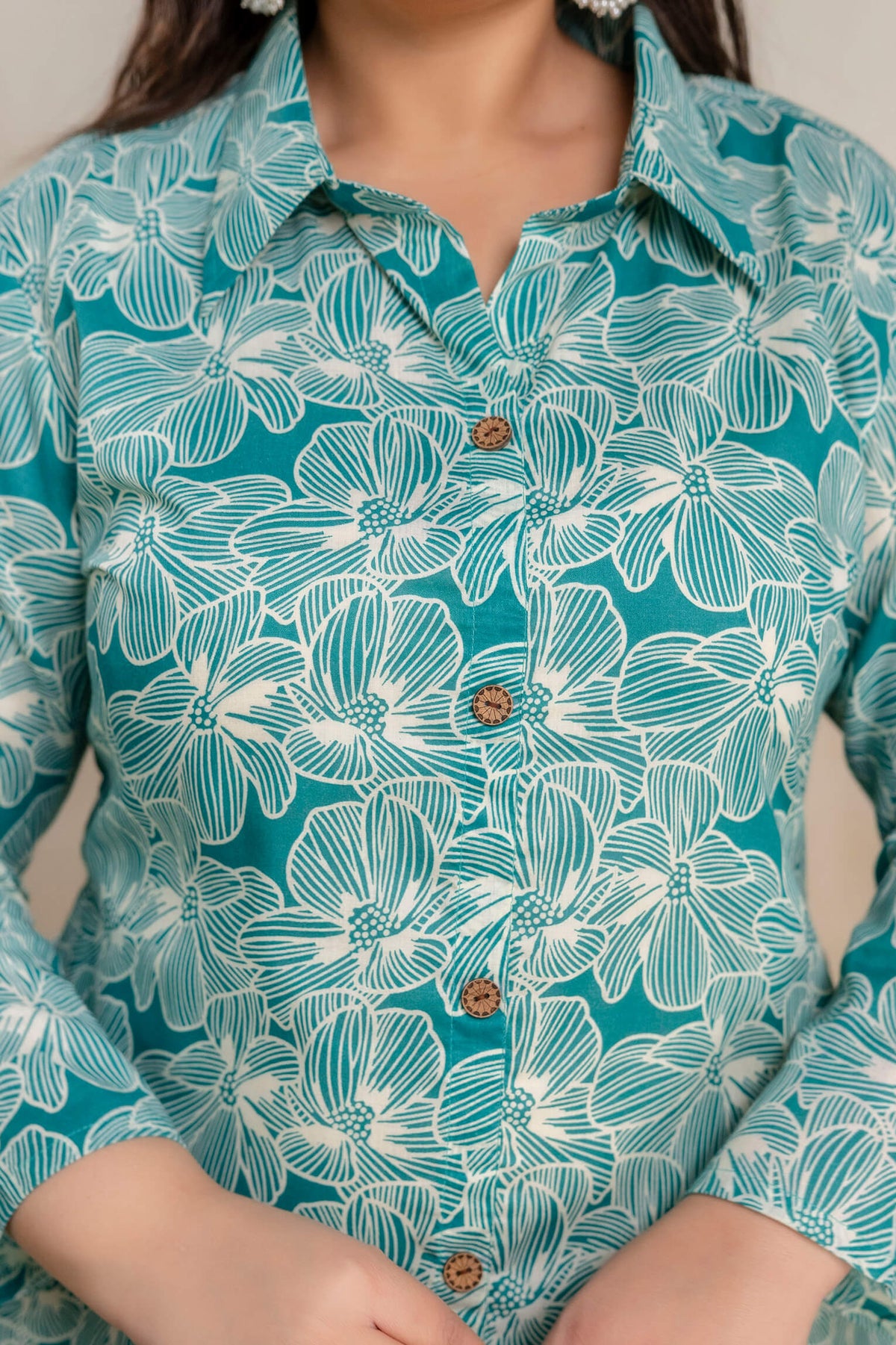 Close-up of plus size teal floral cotton kurti buttons for fat women, premium big size clothing detail
