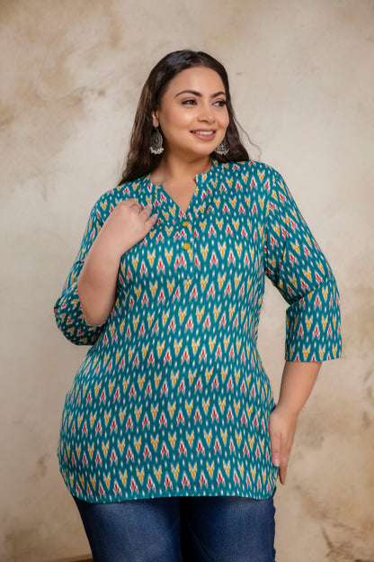 Side pose of plus size teal green ikat cotton short kurti tunic for daily wear