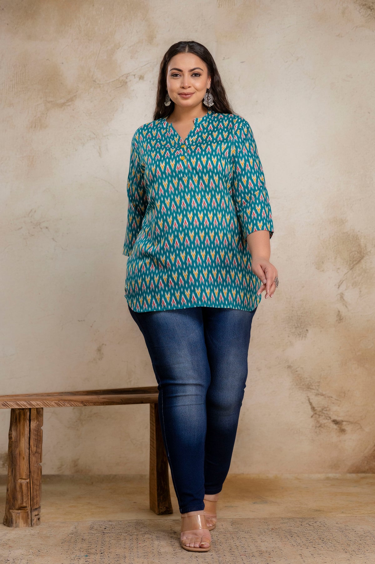 Full length plus size teal green ikat cotton short kurti styled with jeans