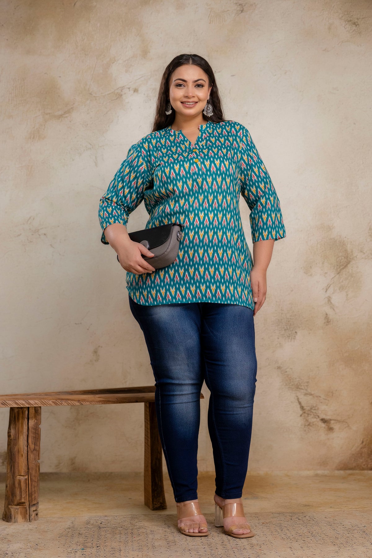 Lifestyle image of fat teal green ikat cotton short kurti tunic for casual wear